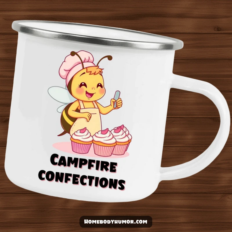 Funny Bee Campfire Mug: A busy bee in an apron frosting cupcakes, perfect for enjoying hot drinks outdoors with humorous charm. A wonderful funny gift.