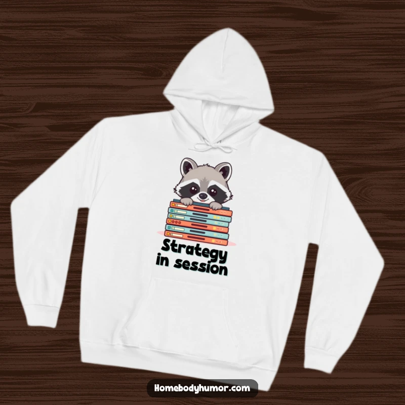 Funny raccoon peeking from board games hoodie, a warm and humorous top for dedicated board game players.