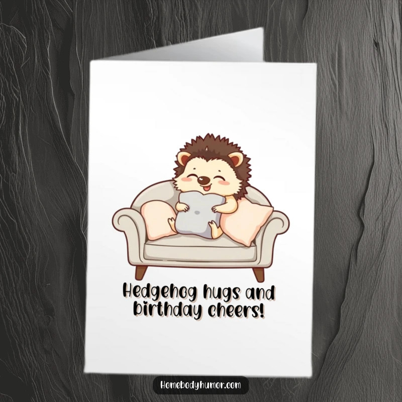 Funny Free Printable Birthday Card: Giggling hedgehog arranging sofa cushions, cozy and cute, perfect for homebodies, downloadable.